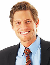 photo of a smiling man in a business suit and tie